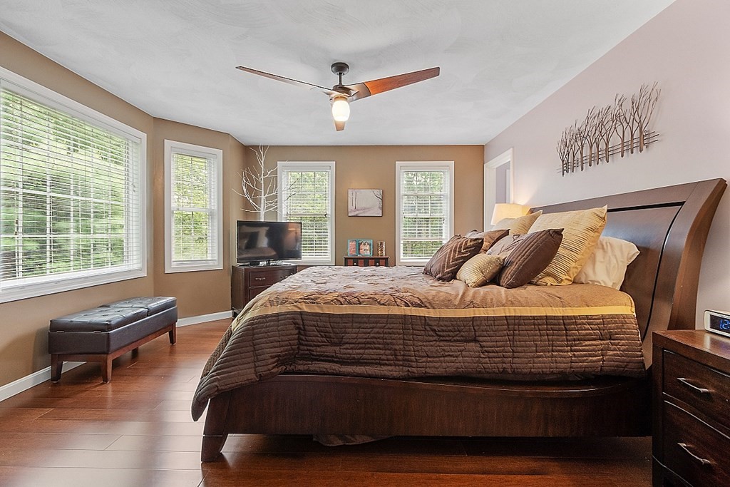 55 Rowley Hill Road Sterling, MA 01564 - Photo 21 of 42 a spacious bedroom with a bed and a large window