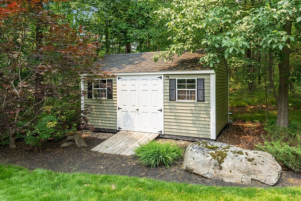 55 Rowley Hill Road Sterling, MA 01564 - Photo 34 of 42 a side view of a house with garden