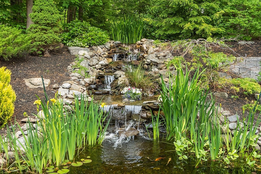 55 Rowley Hill Road Sterling, MA 01564 - Photo 41 of 42 a backyard of a house with a garden