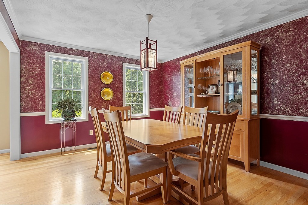 55 Rowley Hill Road Sterling, MA 01564 - Photo 6 of 42 a view of a dining room with furniture and chandelier