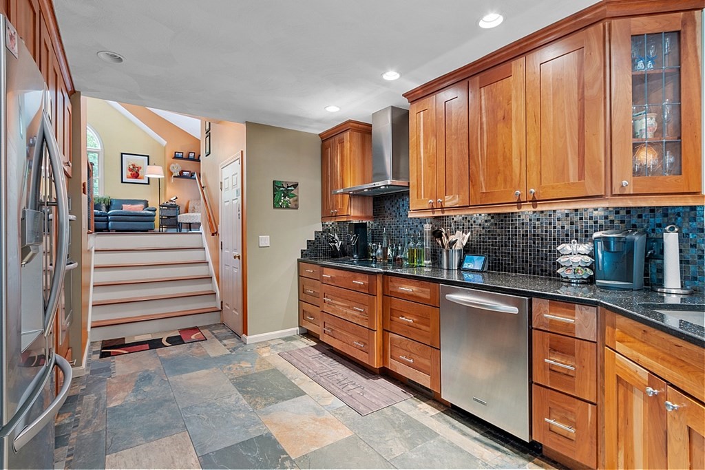 55 Rowley Hill Road Sterling, MA 01564 - Photo 8 of 42 a kitchen with stainless steel appliances granite countertop a refrigerator and cabinets