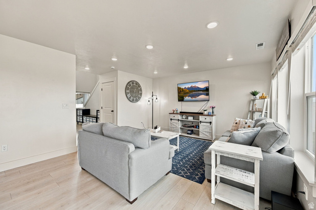 1566 Silver Canoe Loop Logan, UT 84321 - Photo 15 of 44 Recessed lighting, light wood-finish flooring, and multiple windows with blinds