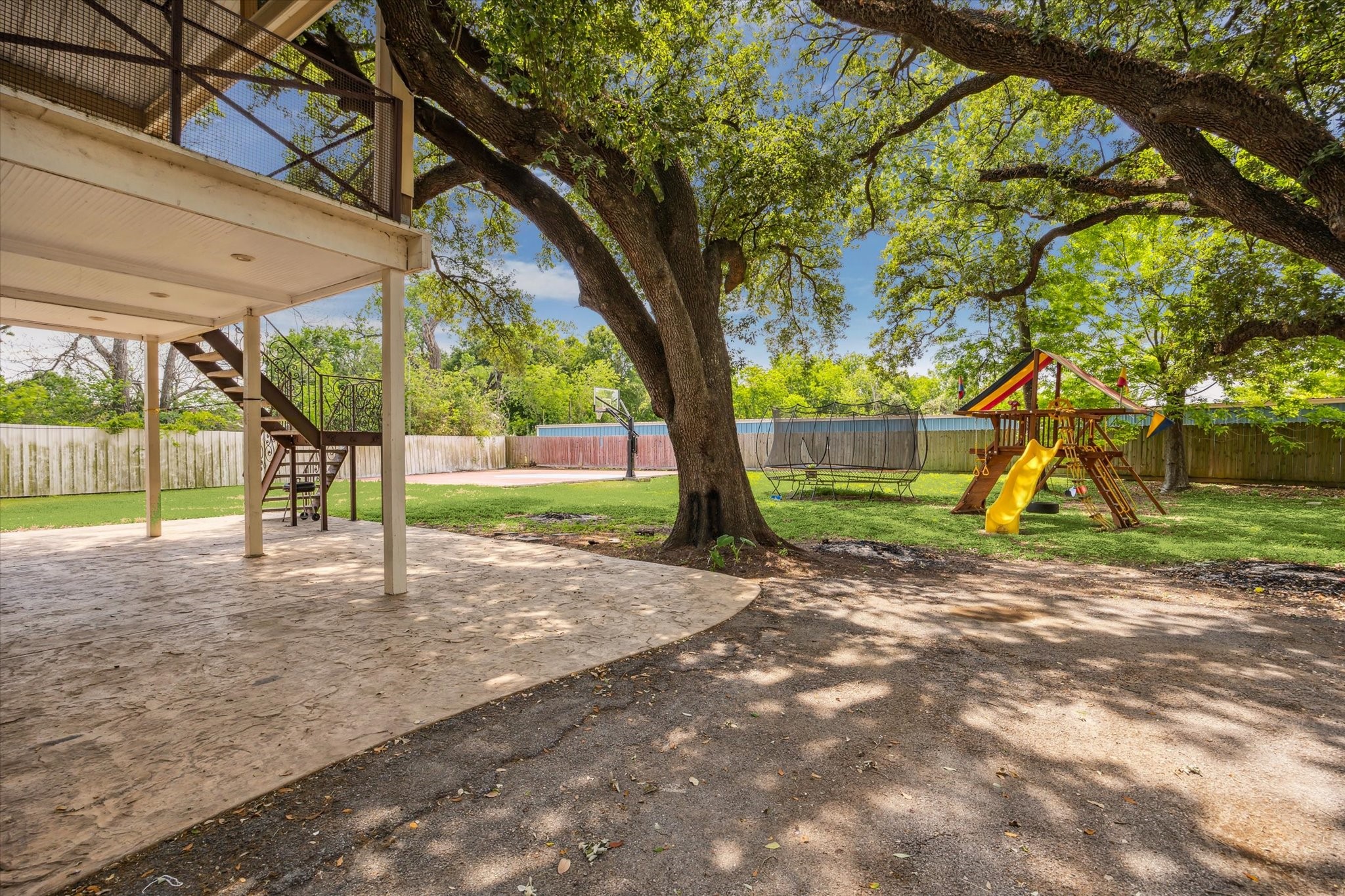 5530 Allen-Genoa Road Houston, TX 77504 - Photo 16 of 19 a view of a yard in front of a house with a large tree