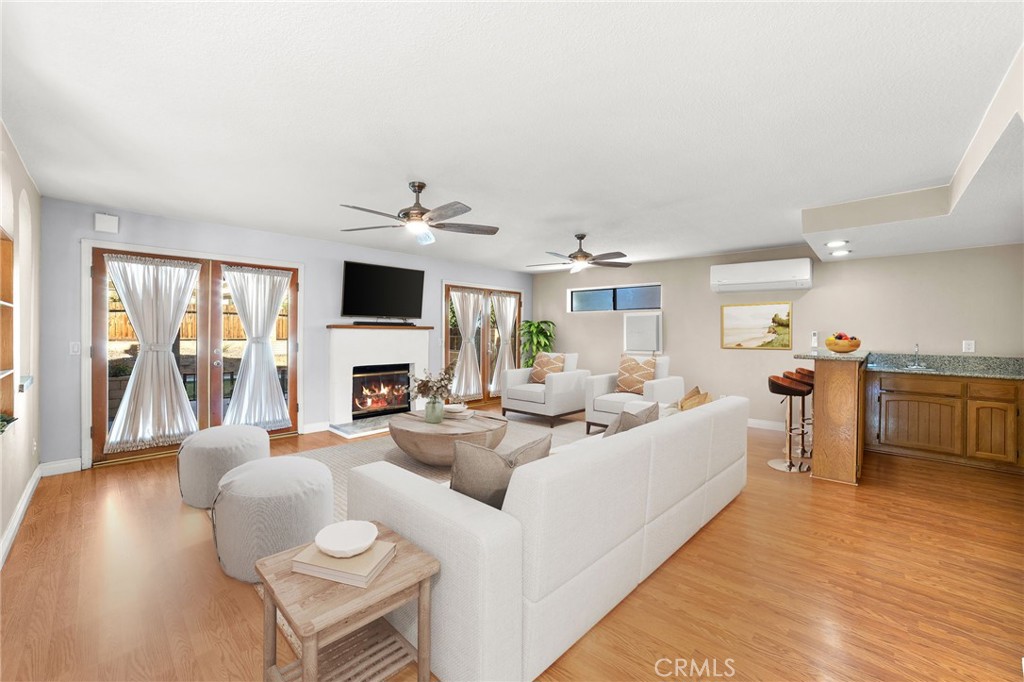 17800 Rancho Bonita Road Victorville, CA 92395 - Photo 14 of 52 a living room with furniture and a flat screen tv