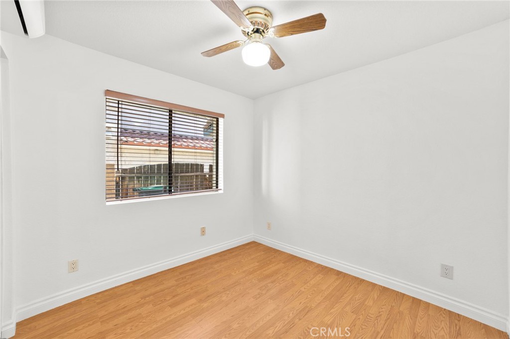 17800 Rancho Bonita Road Victorville, CA 92395 - Photo 18 of 52 an empty room with a window and a fan