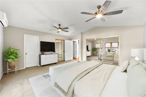 a view of a white house with a big yard and large trees