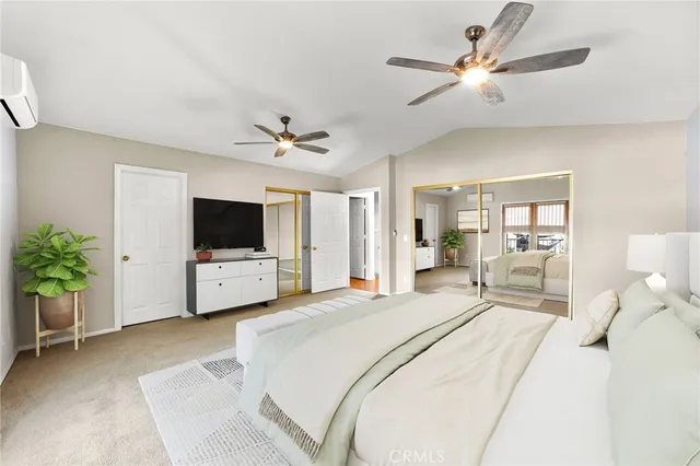 a view of a white house with a big yard and large trees