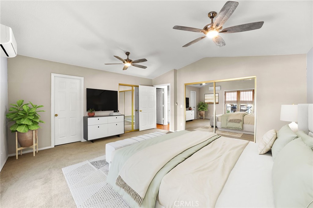 17800 Rancho Bonita Road Victorville, CA 92395 - Photo 25 of 52 a bedroom with a bed a flat screen tv and a couch