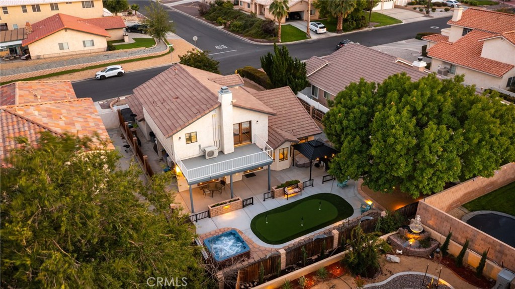 17800 Rancho Bonita Road Victorville, CA 92395 - Photo 34 of 52 an aerial view of a house with a yard and a large tree