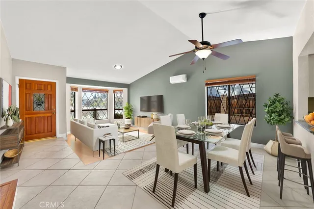 a view of a livingroom with furniture window and wooden floor