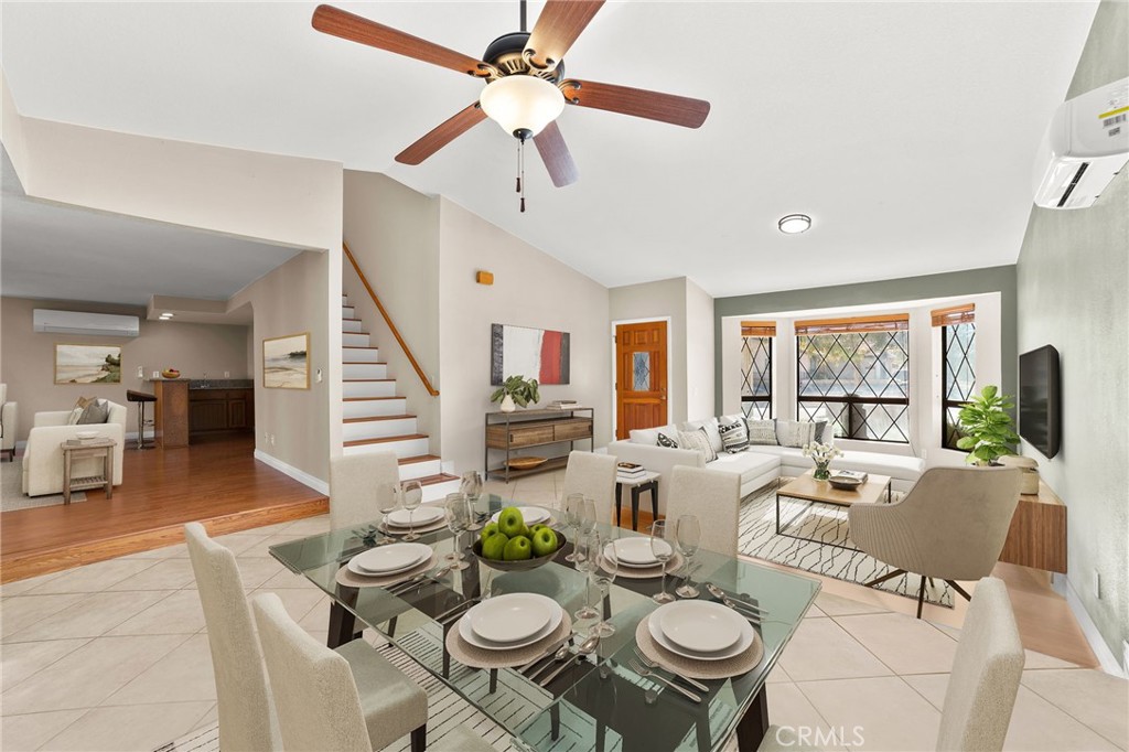 17800 Rancho Bonita Road Victorville, CA 92395 - Photo 7 of 52 a view of a dining room with furniture a chandelier and wooden floor