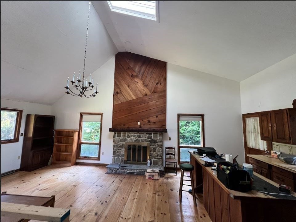 12 Sears Road Sandisfield, MA 01255 - Photo 13 of 22 a living room with furniture a fireplace and a flat screen tv