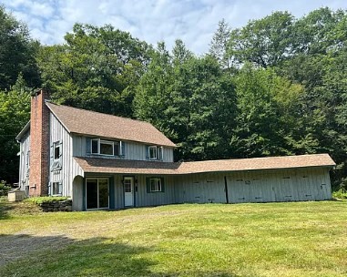 12 Sears Road Sandisfield, MA 01255 - Photo 2 of 22 a view of a house with a garden and a tree