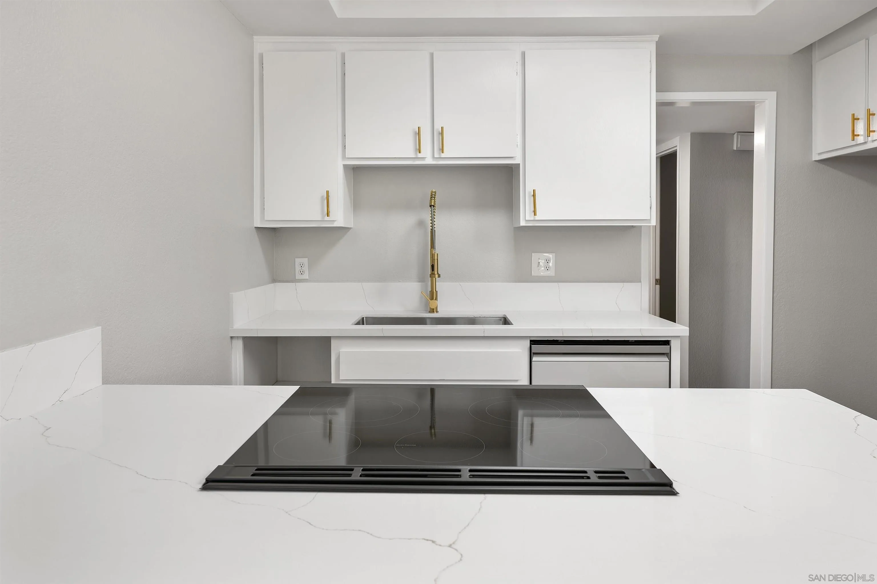 2157 Arnold Way, Unit 312 Alpine, CA 91901 - Photo 12 of 26 a kitchen with kitchen island a sink stove and refrigerator