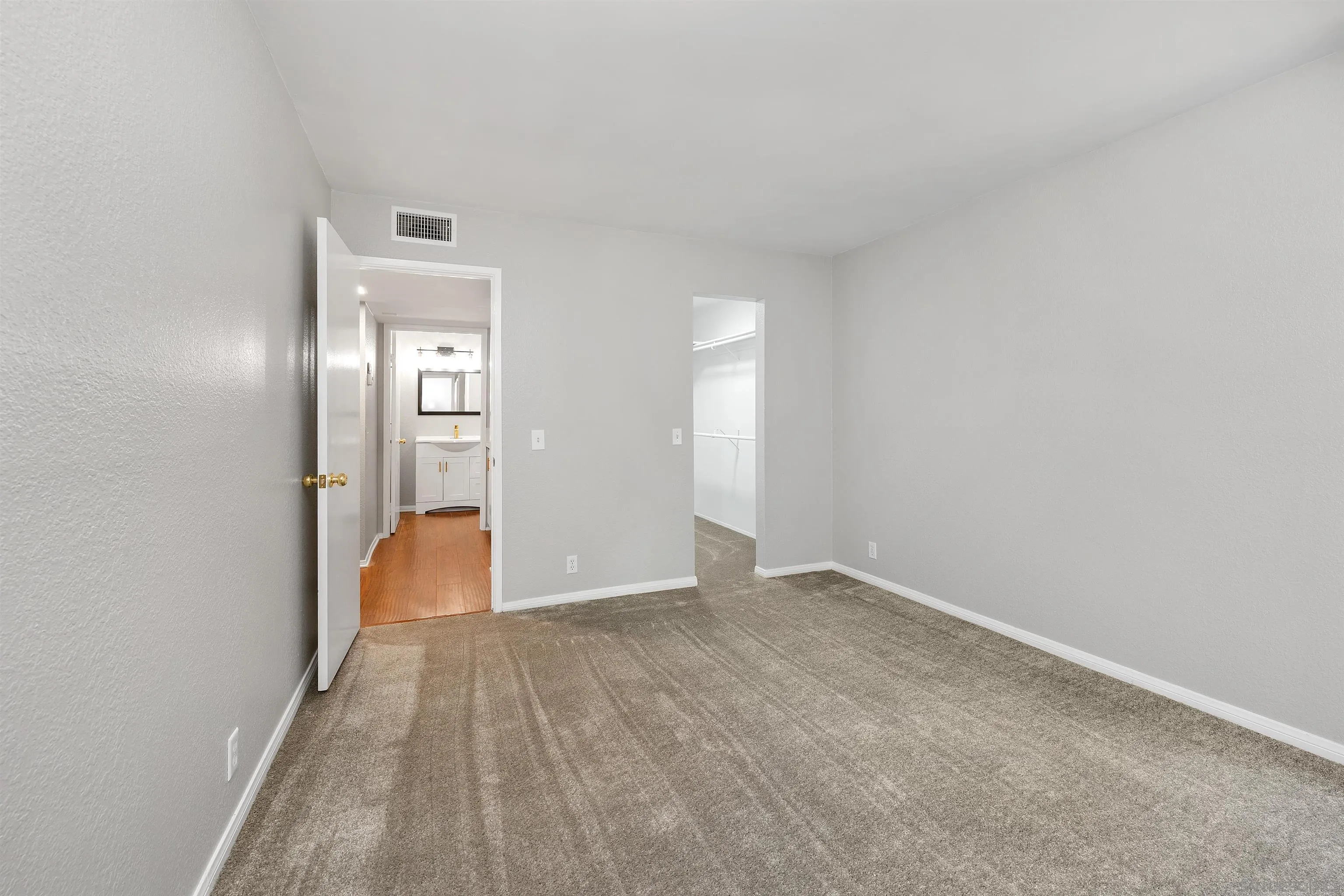 2157 Arnold Way, Unit 312 Alpine, CA 91901 - Photo 16 of 26 a view of a room with wooden floor and bathroom