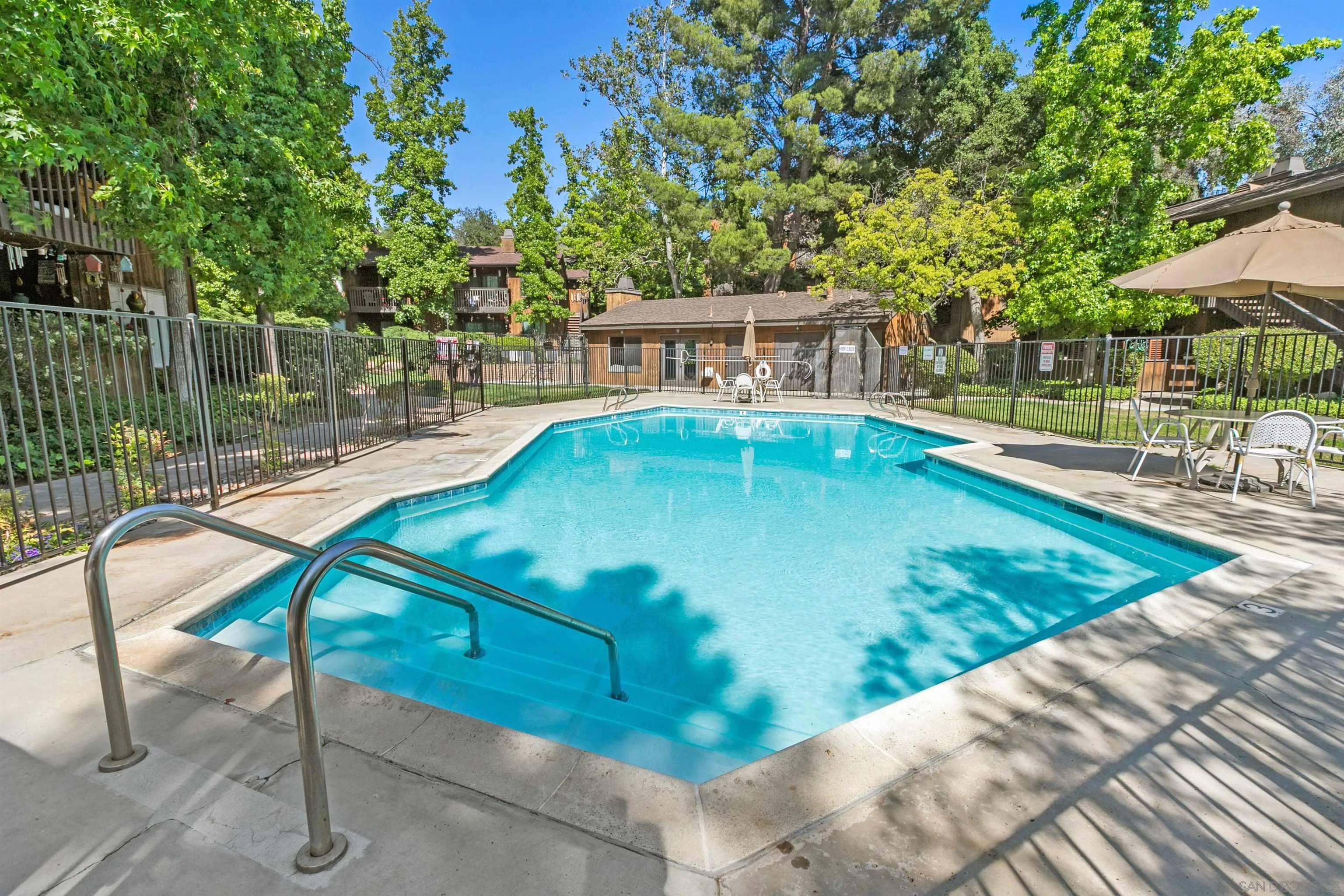 2157 Arnold Way, Unit 312 Alpine, CA 91901 - Photo 25 of 26 a view of a swimming pool with a patio and a yard