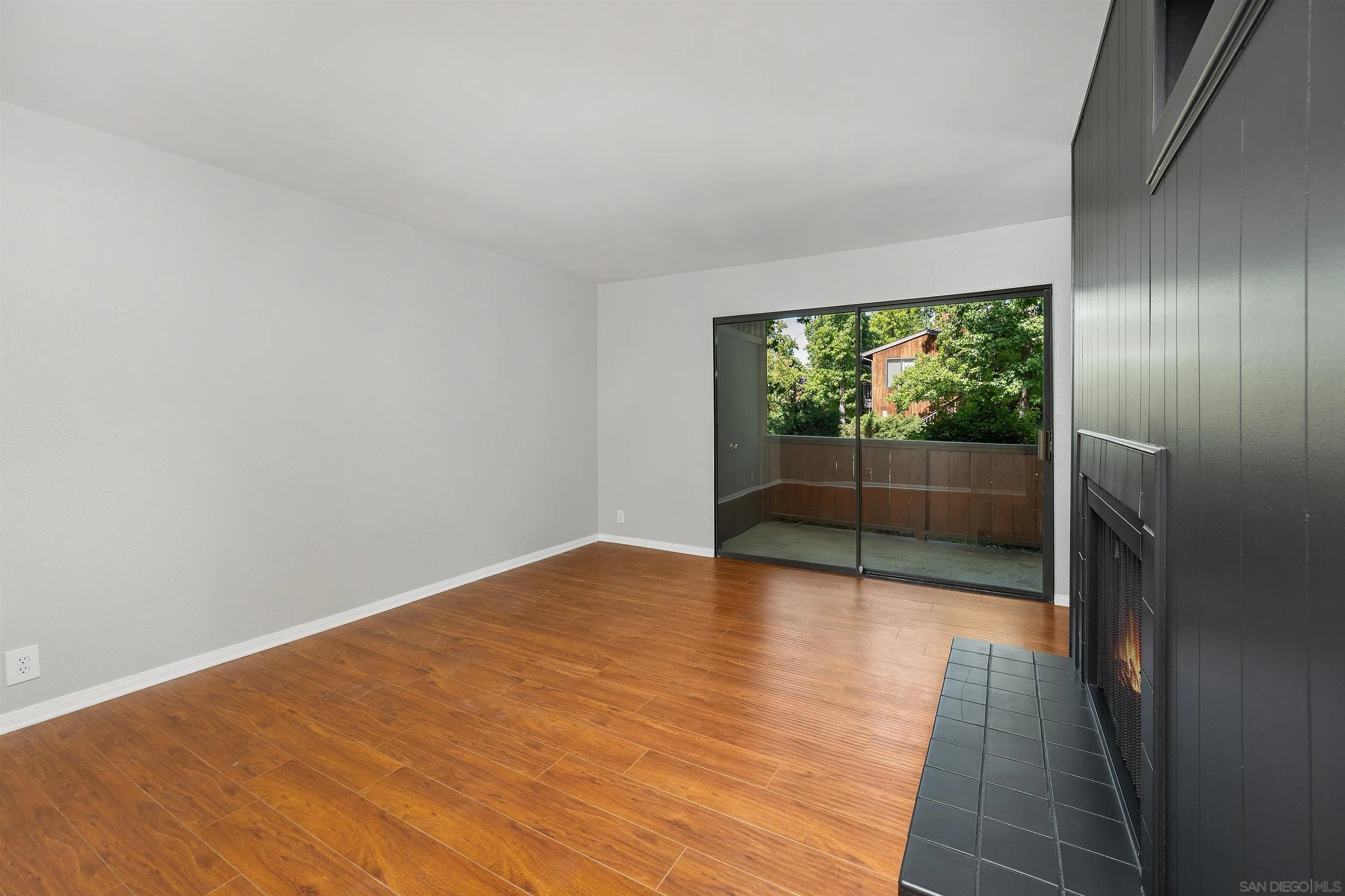 2157 Arnold Way, Unit 312 Alpine, CA 91901 - Photo 5 of 26 a view of empty room with wooden floor and fan
