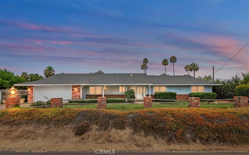 15833 Ridgeway Avenue Riverside, CA 92508 - Photo 1 of 1 a front view of a house with a yard