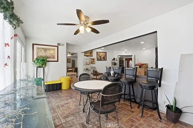 a dining room with furniture and window