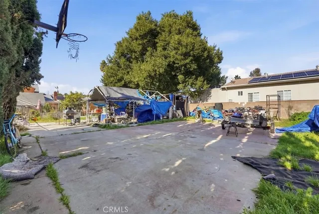 a view of a street with a bench in front of it