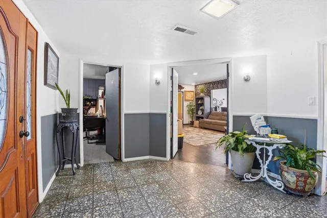a view of entryway with furniture and a potted plant