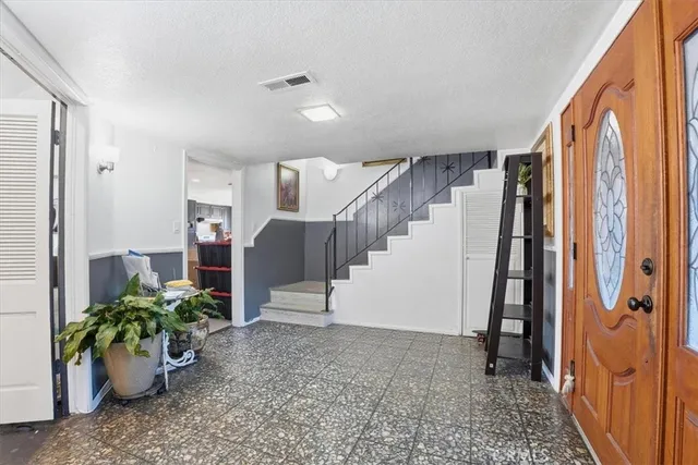 a view of an entryway with stairs