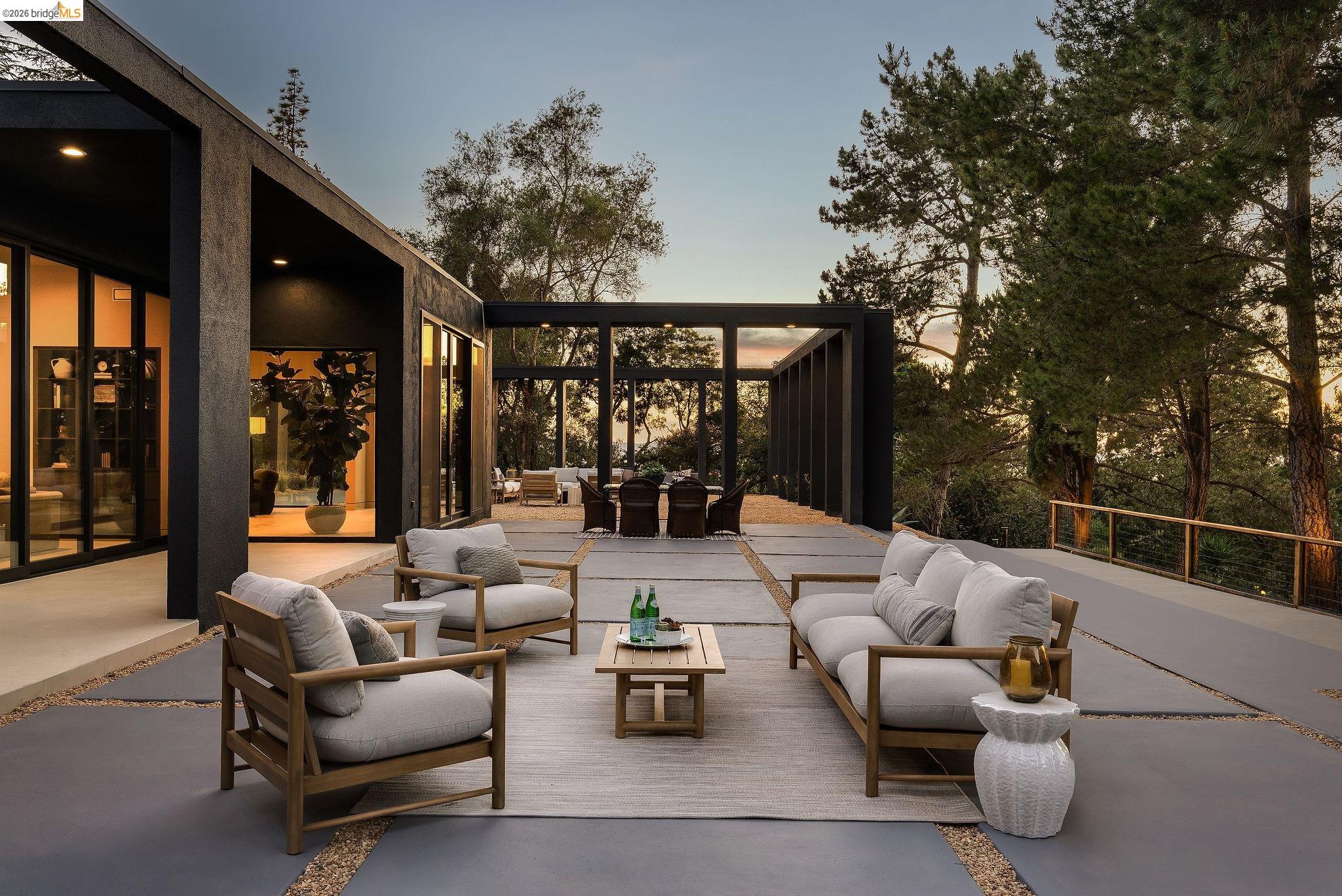 Patio terrace at dusk with an outdoor hangout area, a patio, and a sunroom