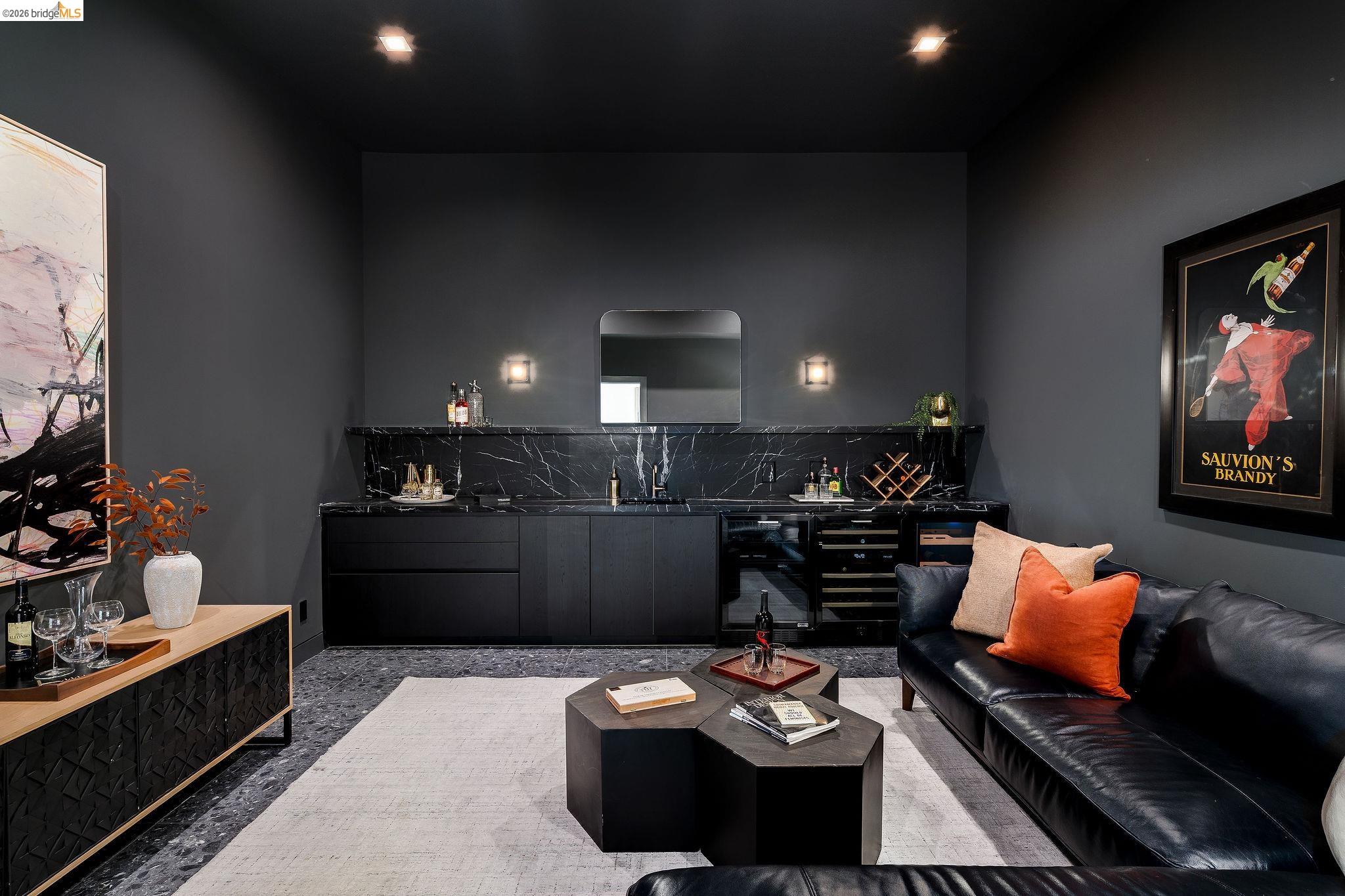 5645 Bacon Road Oakland, CA 94619 - Photo 20 of 60 Living room with bar with sink, recessed lighting, and dark aggregate flooring