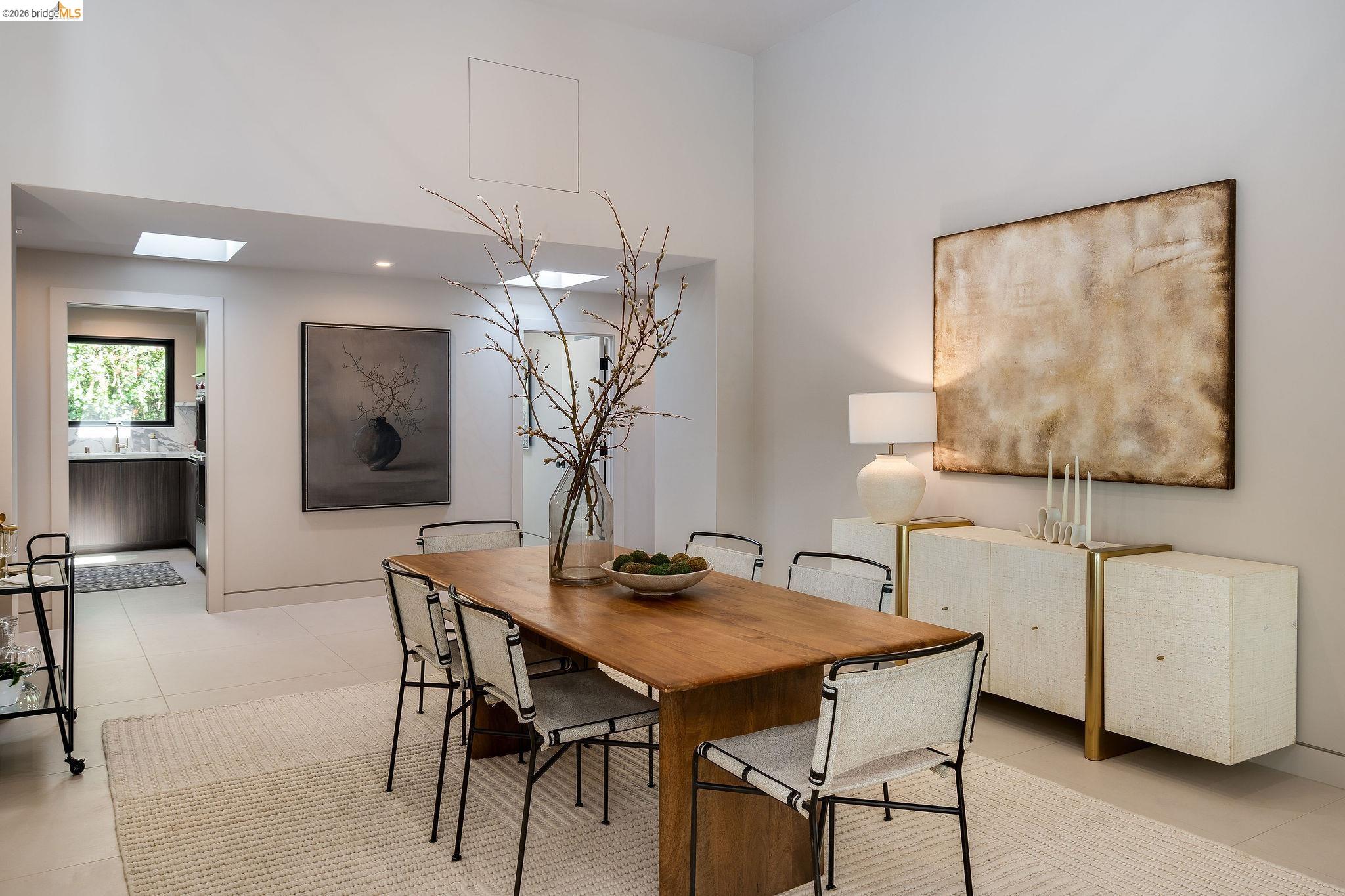 5645 Bacon Road Oakland, CA 94619 - Photo 21 of 60 Dining room featuring light tile patterned floors and a skylight