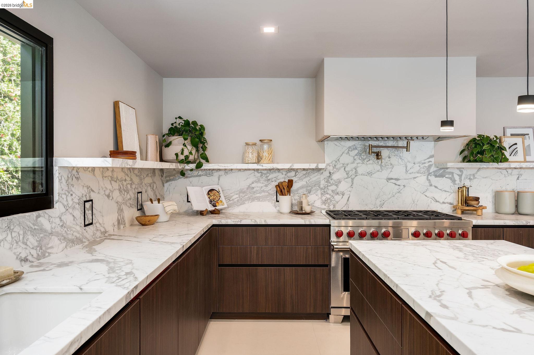 5645 Bacon Road Oakland, CA 94619 - Photo 28 of 60 Kitchen with dark wood finish cabinets, open shelves, and designer stove
