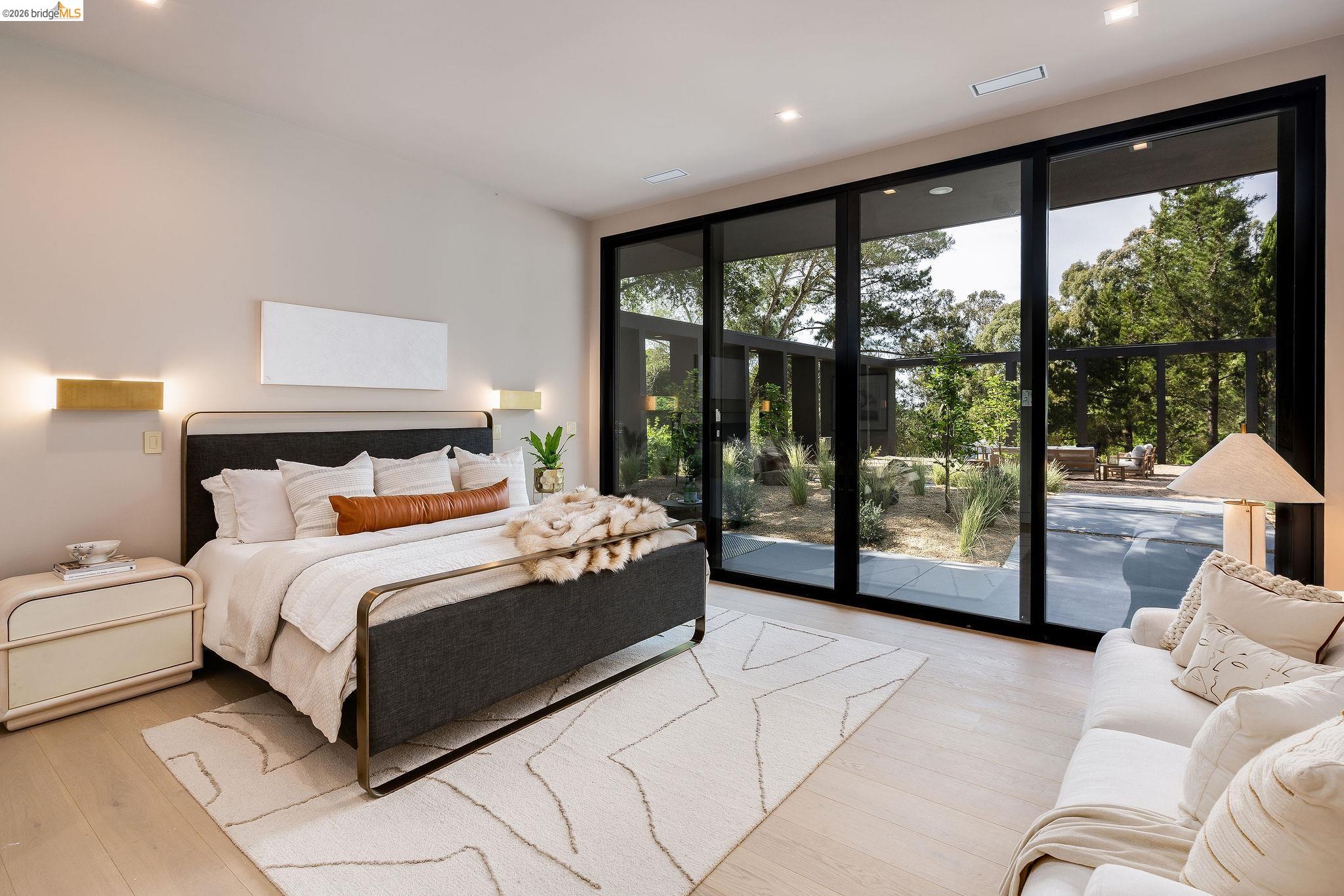 5645 Bacon Road Oakland, CA 94619 - Photo 30 of 60 Bedroom featuring expansive windows, hardwood / wood-style floors, recessed lighting, and access to outside