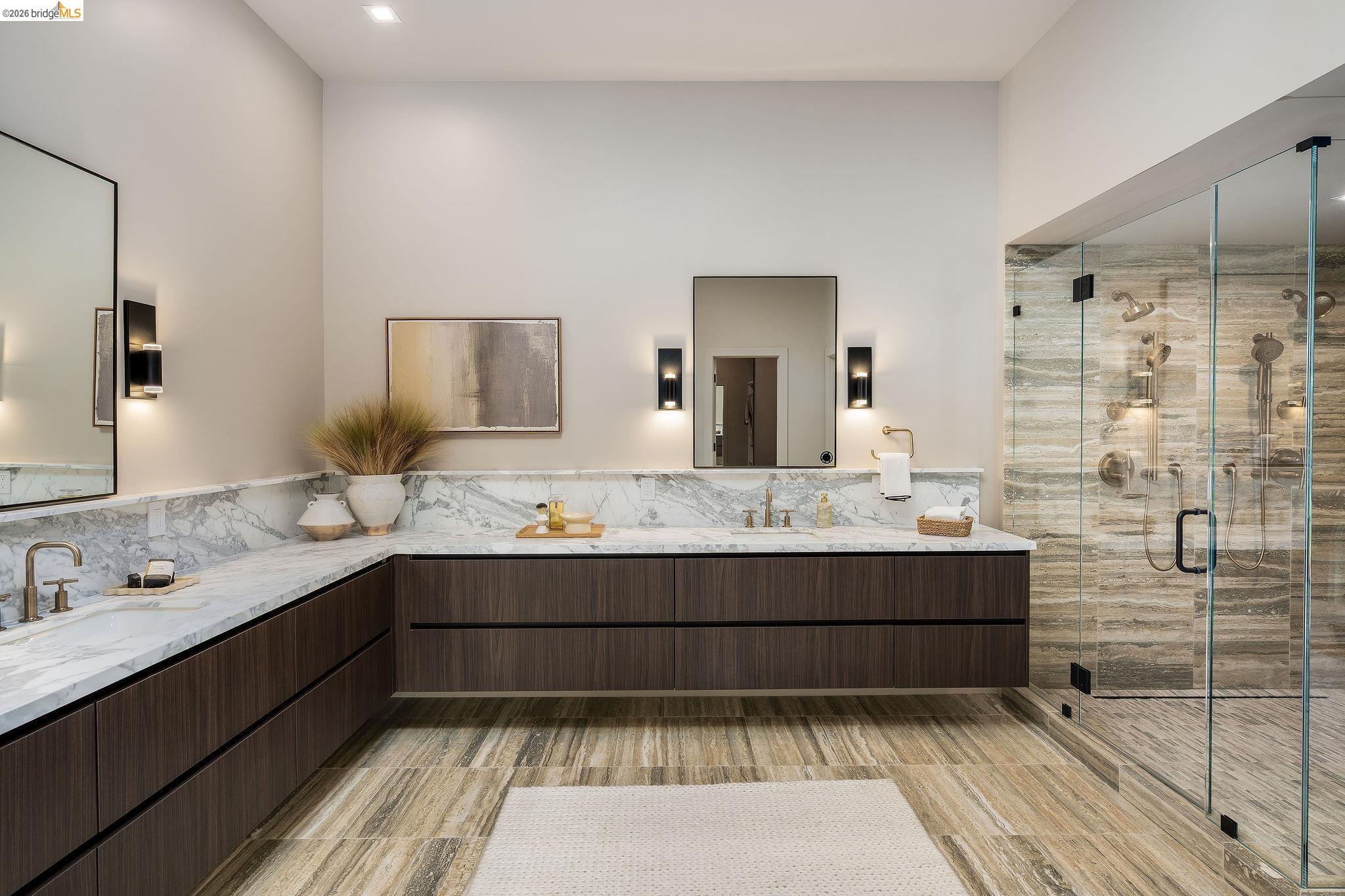 5645 Bacon Road Oakland, CA 94619 - Photo 33 of 60 Bathroom featuring double vanity, a stall shower, and tile walls