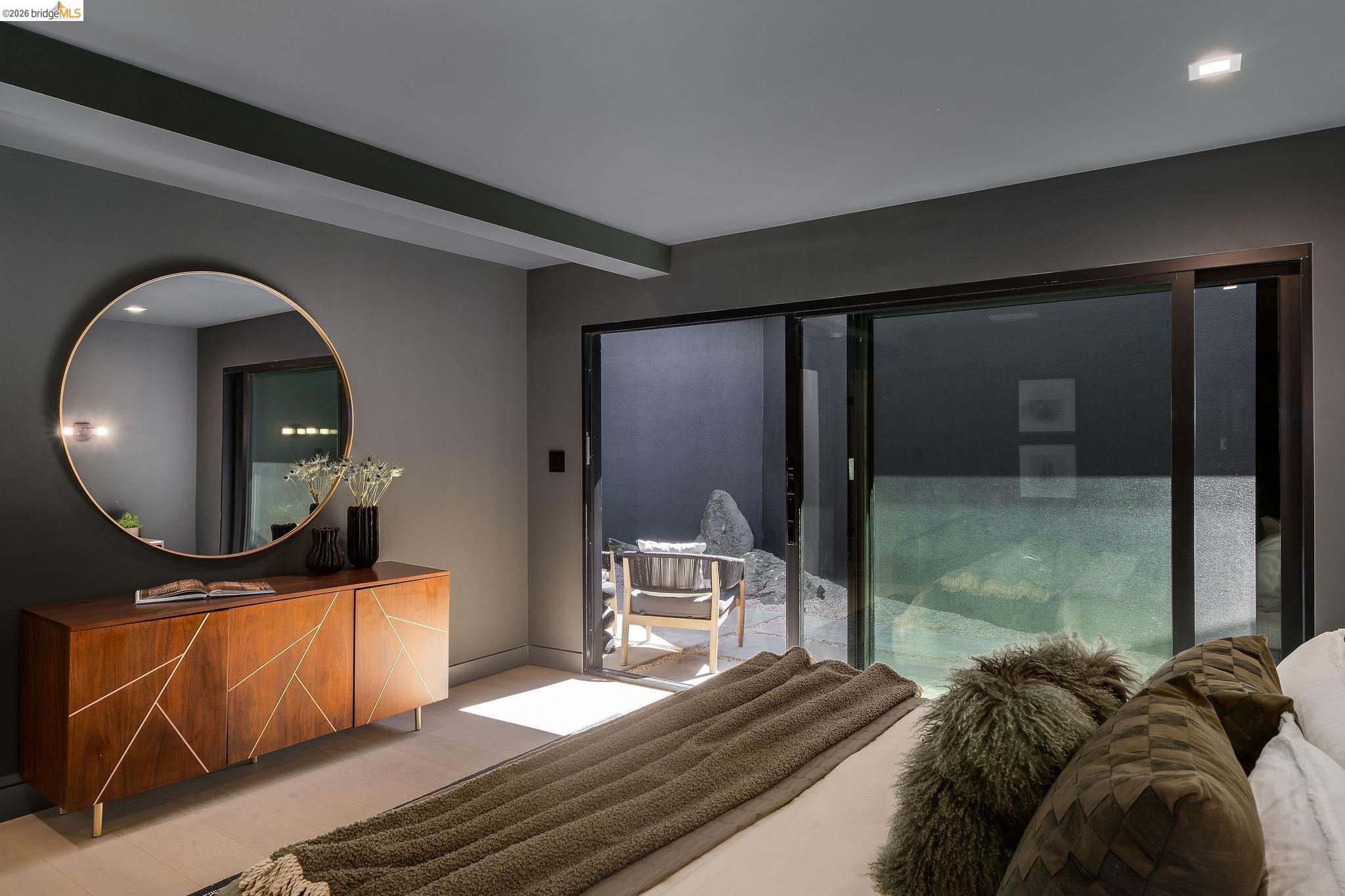 5645 Bacon Road Oakland, CA 94619 - Photo 39 of 60 Bedroom with wood finished floors, beamed ceiling, access to outside, and recessed lighting