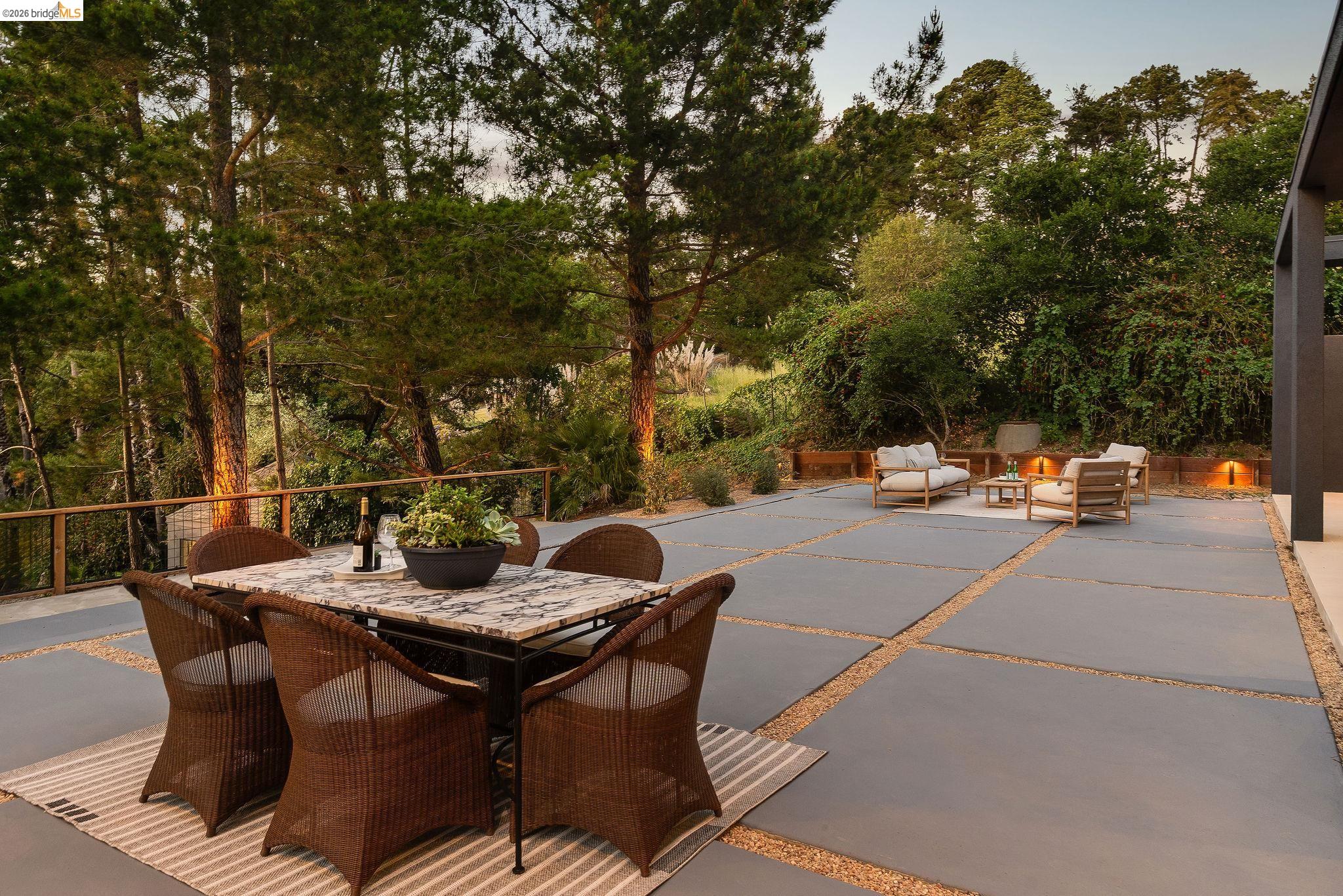 5645 Bacon Road Oakland, CA 94619 - Photo 42 of 60 View of patio / terrace with an outdoor living / dining area and view of wooded area