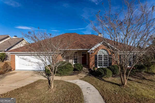 a front view of a house with a yard