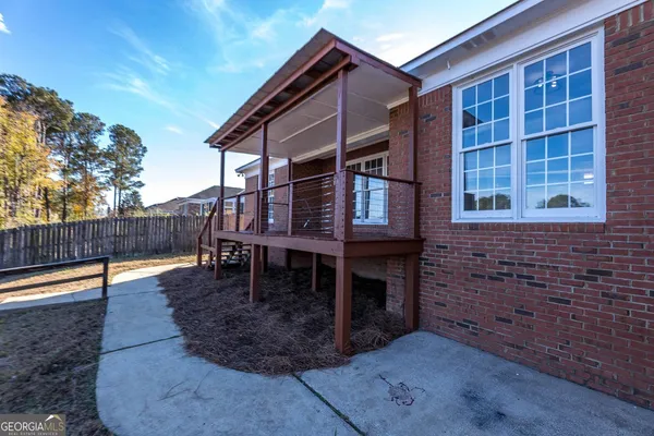 a view of outdoor space with wooden floor and deck