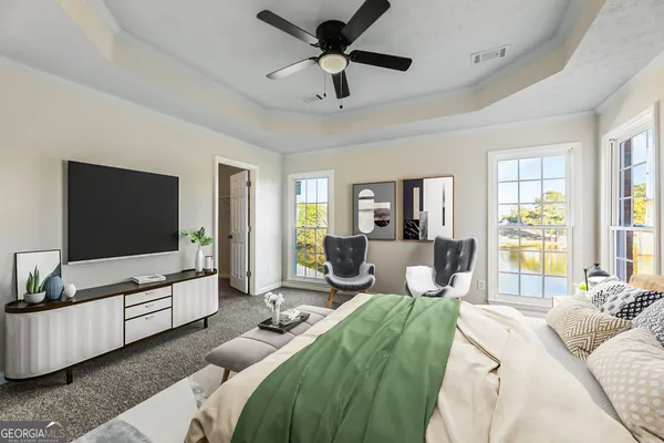 a living room with furniture and a flat screen tv