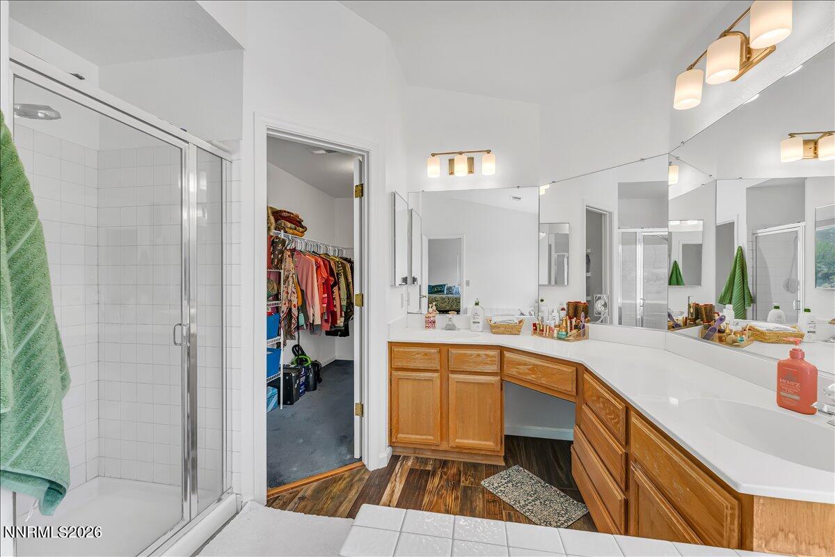 10 Eagle Claw Court Reno, NV 89523 - Photo 24 of 36 a large white kitchen with a sink and a large mirror