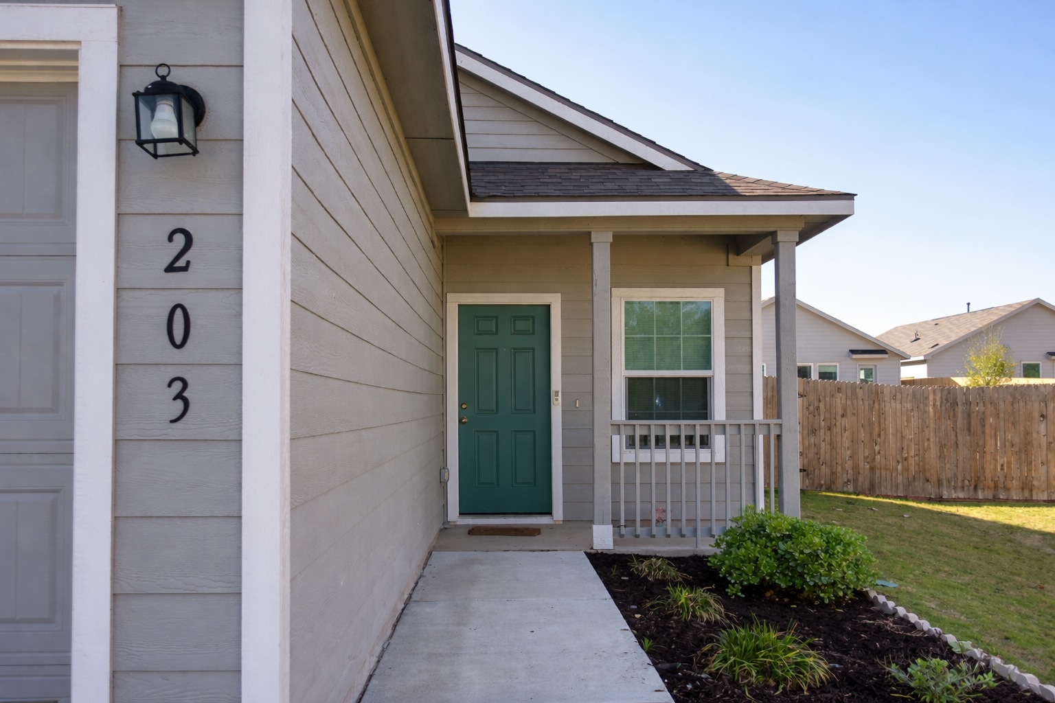 203 Tufted Duck Path Kyle, TX 78640 - Photo 2 of 19 Property entrance featuring a porch and roof with shingles