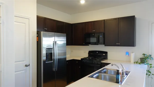 a kitchen with a sink and cabinets