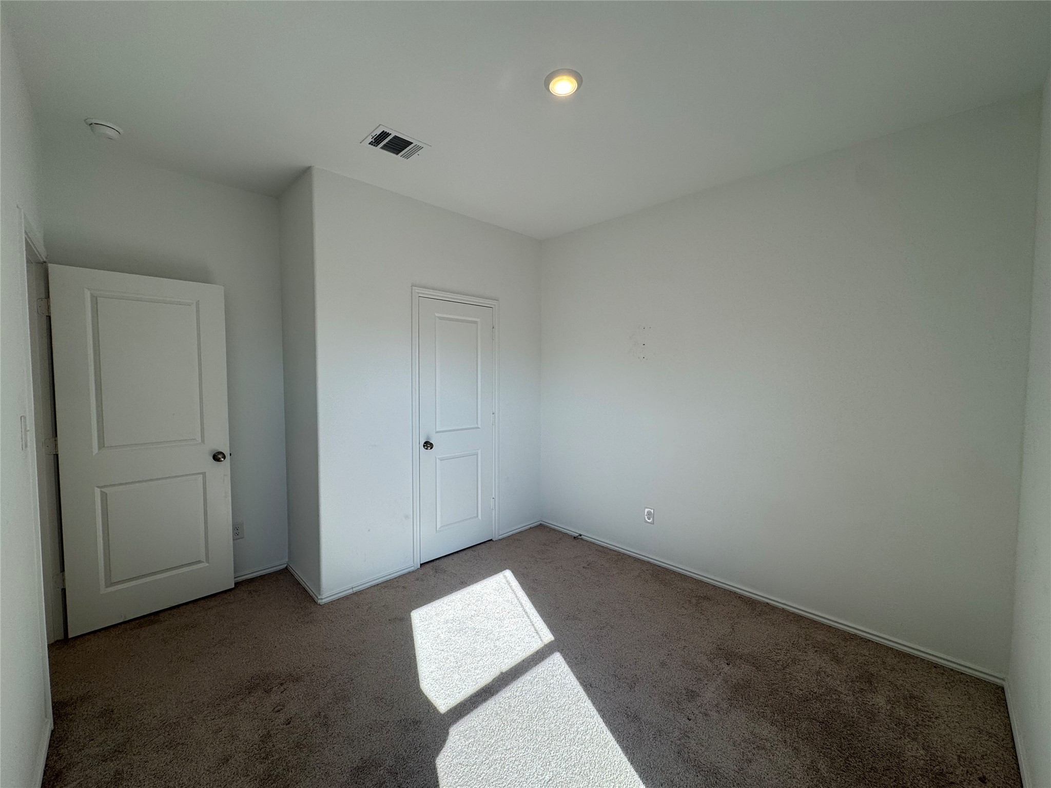 203 Tufted Duck Path Kyle, TX 78640 - Photo 7 of 19 Unfurnished bedroom featuring carpet
