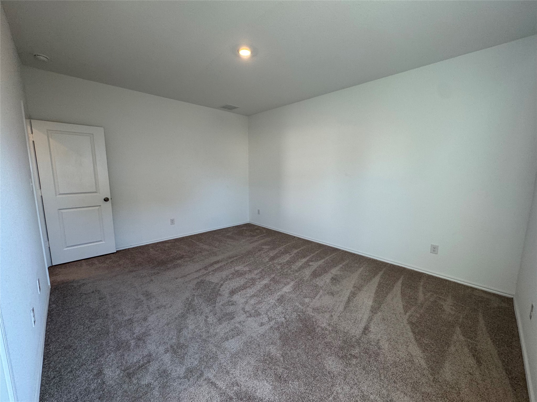 203 Tufted Duck Path Kyle, TX 78640 - Photo 9 of 19 Spare room with dark carpet