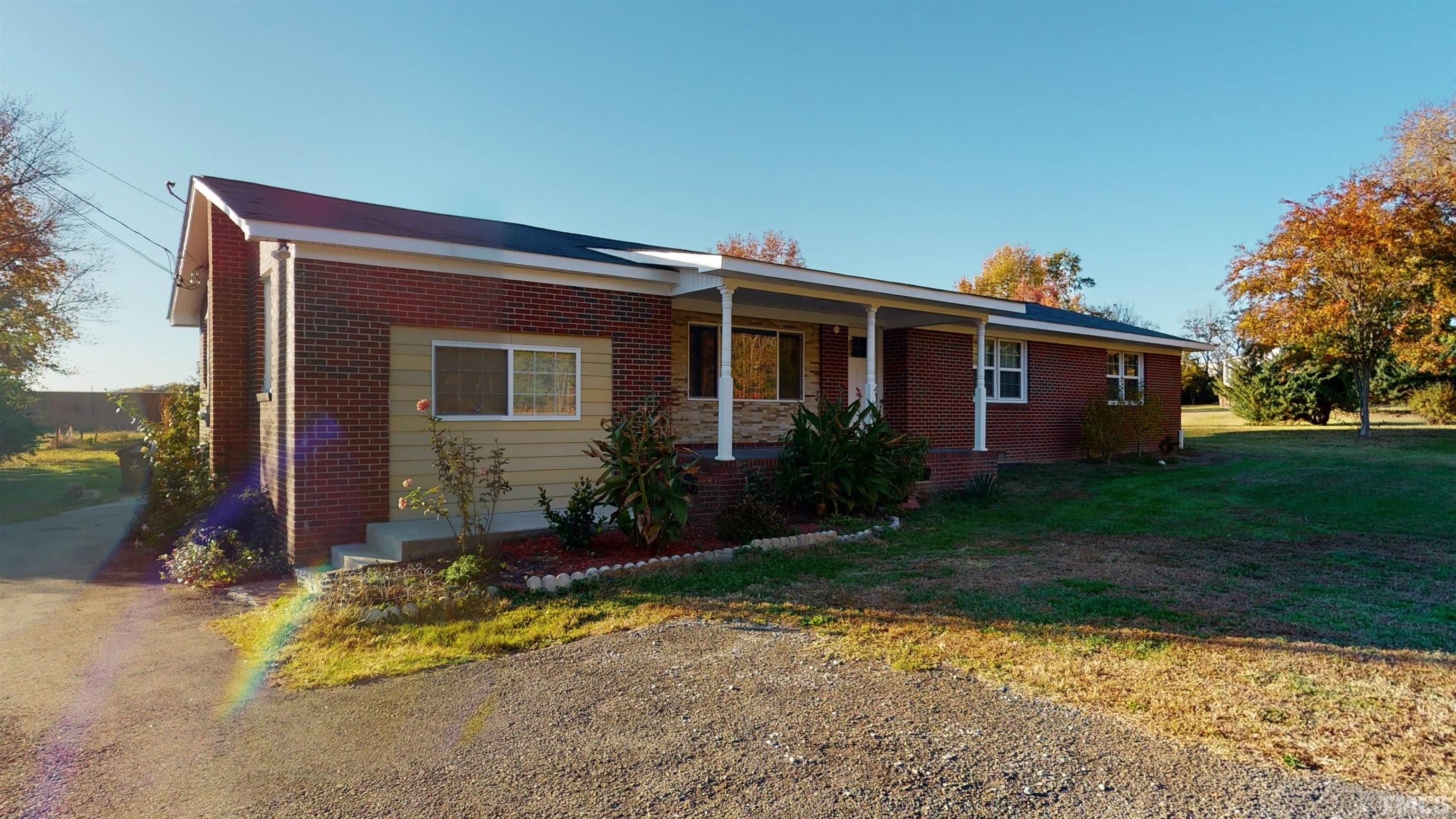 1306 Old Durham Road Roxboro, NC 27573 - Photo 2 of 28 a front view of house with yard