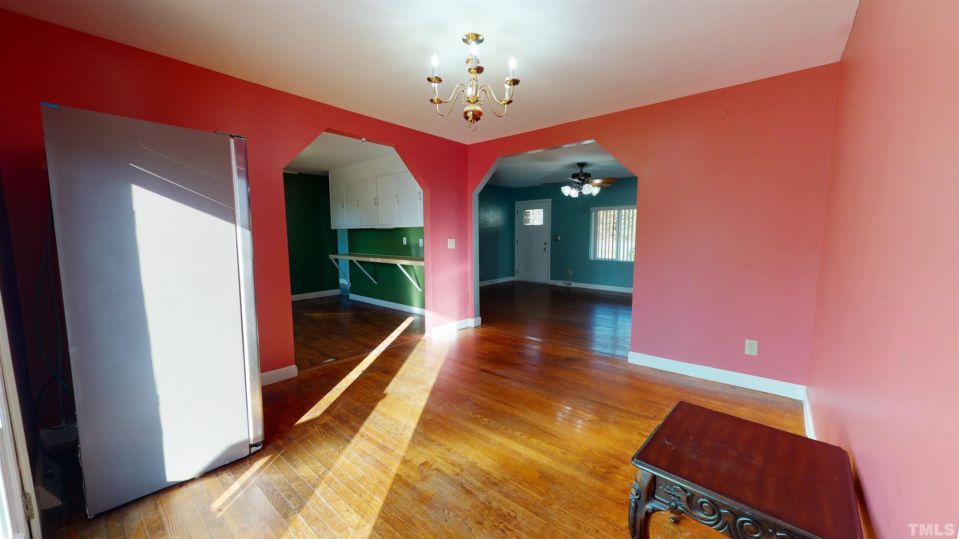 1306 Old Durham Road Roxboro, NC 27573 - Photo 14 of 28 a view of a lobby with black carpet and a chandelier
