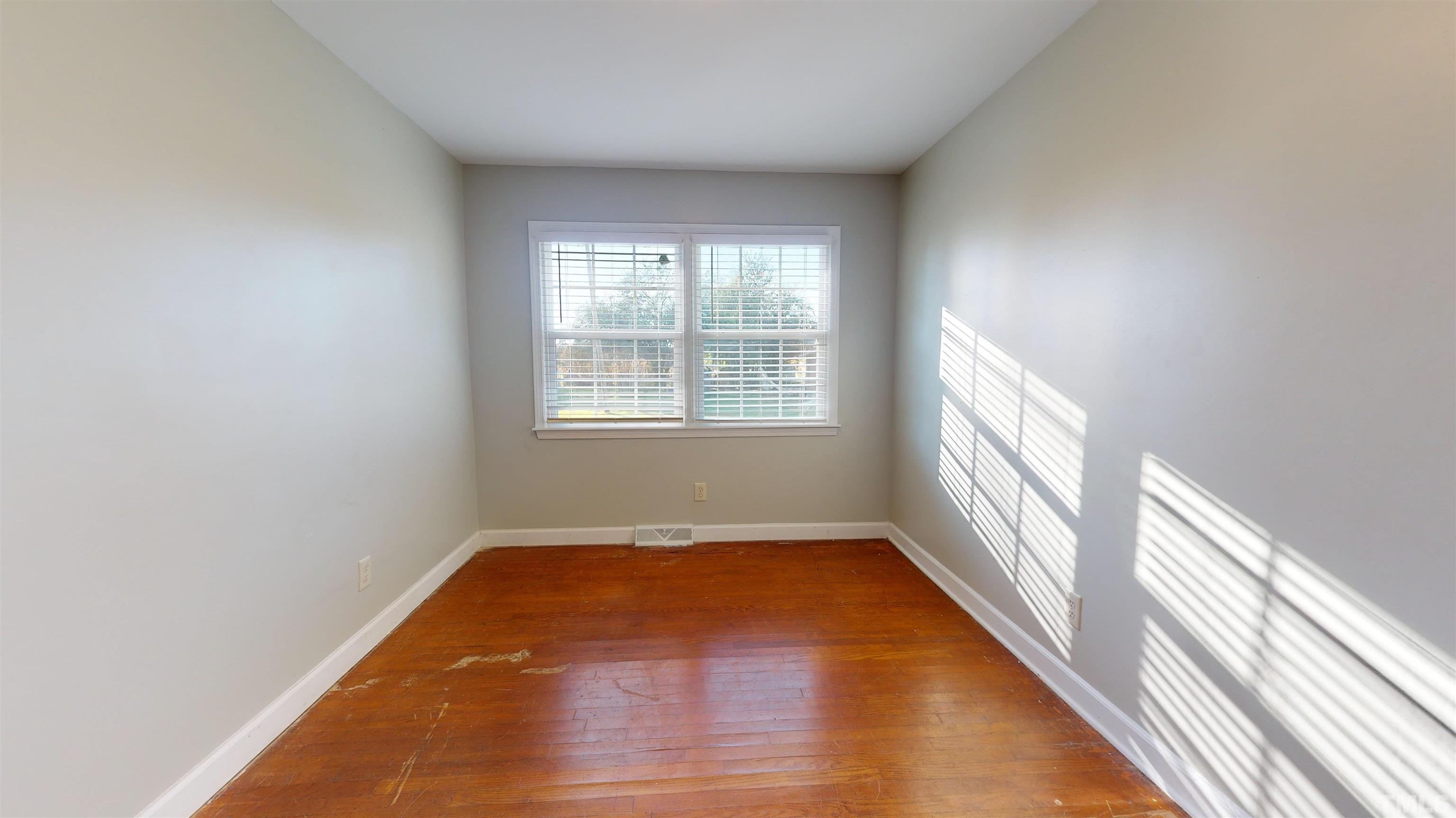 1306 Old Durham Road Roxboro, NC 27573 - Photo 22 of 28 a view of an empty room and window