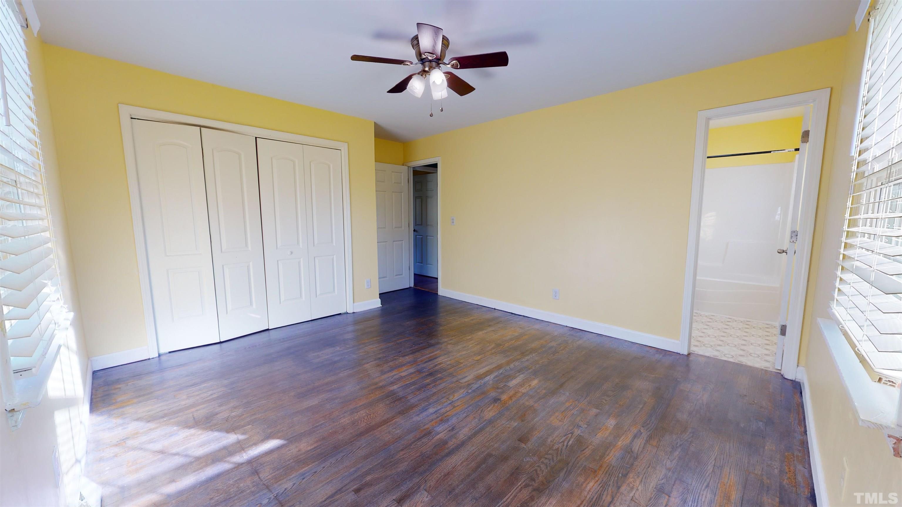 1306 Old Durham Road Roxboro, NC 27573 - Photo 25 of 28 wooden floor in an empty room with a window