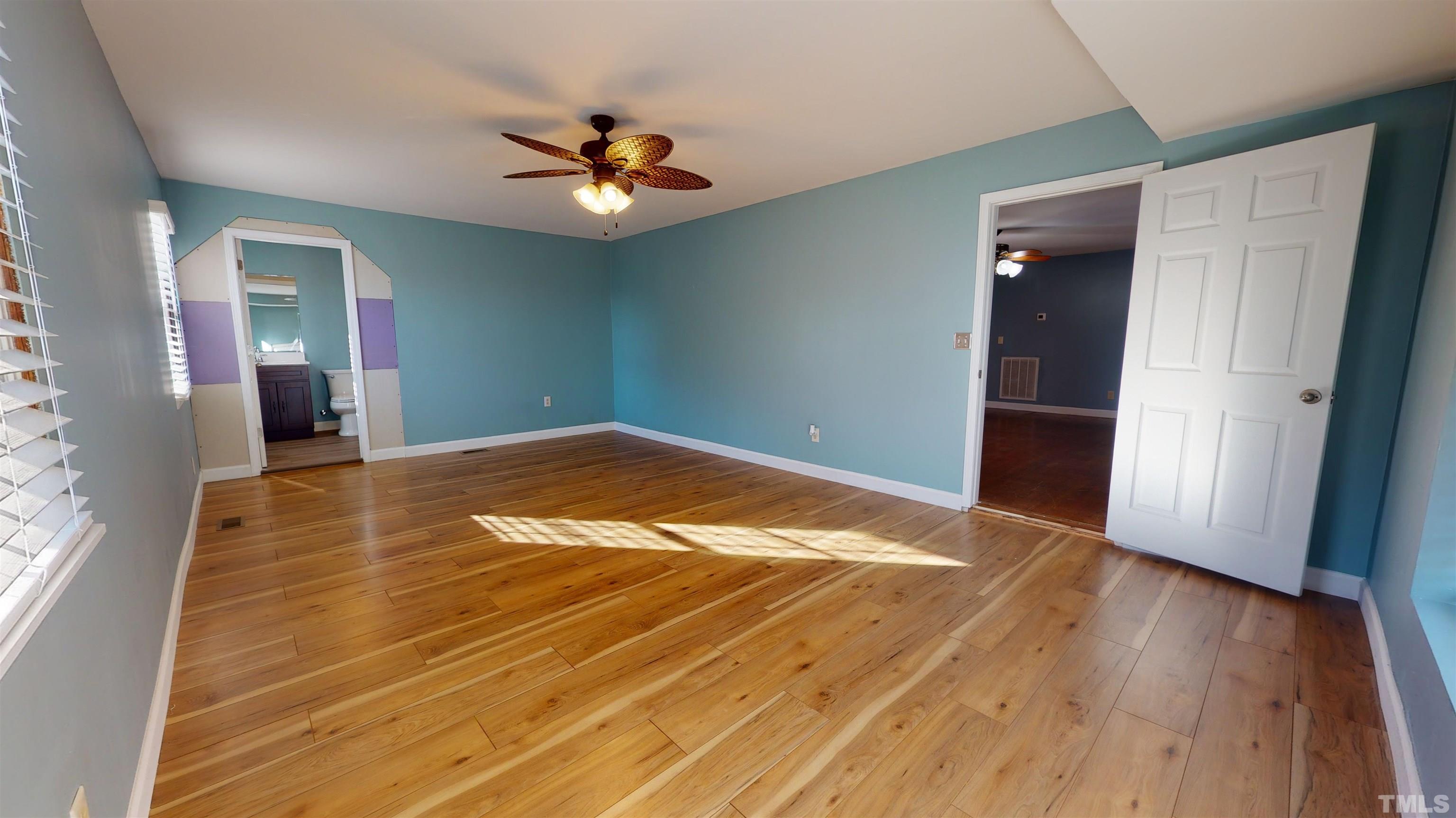 1306 Old Durham Road Roxboro, NC 27573 - Photo 4 of 28 a view of empty room with wooden floor