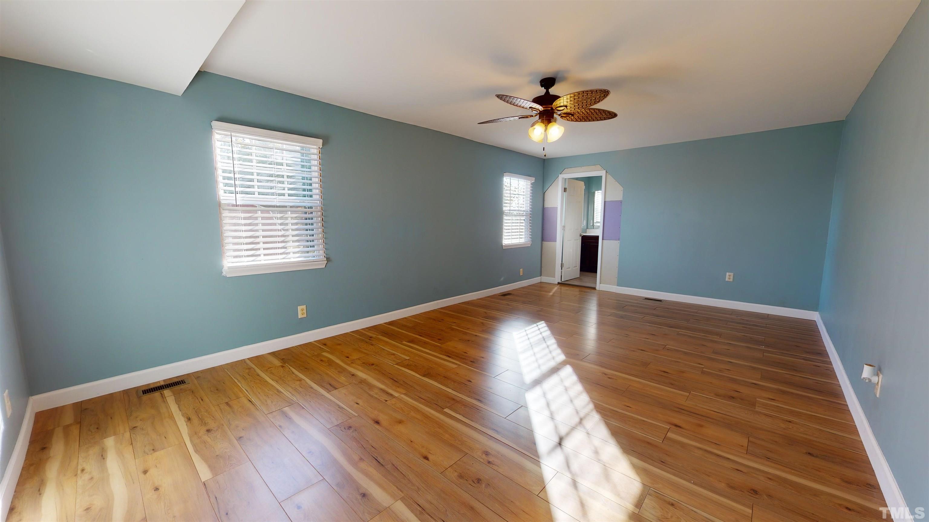 1306 Old Durham Road Roxboro, NC 27573 - Photo 6 of 28 a view of empty room with window and ceiling fan