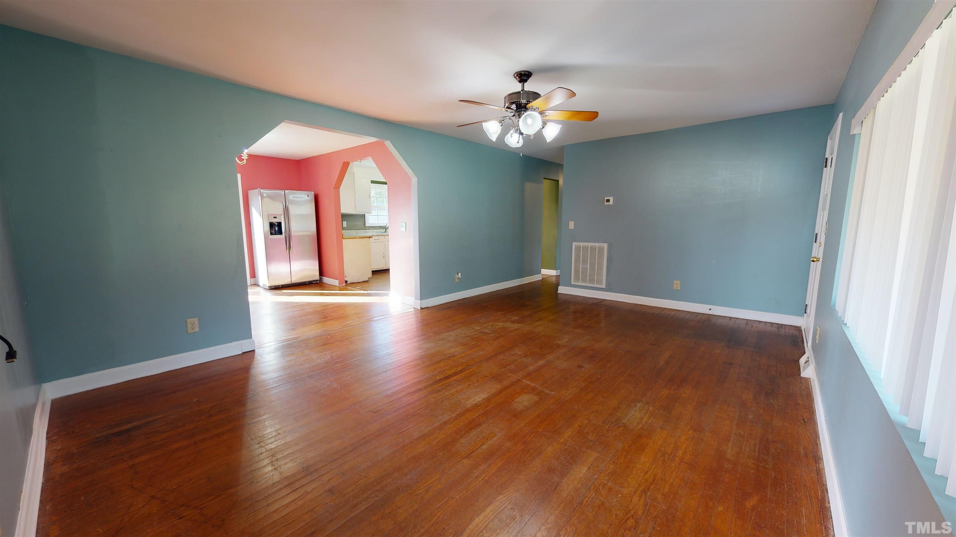 1306 Old Durham Road Roxboro, NC 27573 - Photo 7 of 28 a view of a livingroom with wooden floor