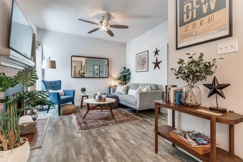 a living room with furniture or couch and a potted plant